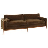 A Walnut Framed Sofa by T.H. Robsjohn-Gibbings